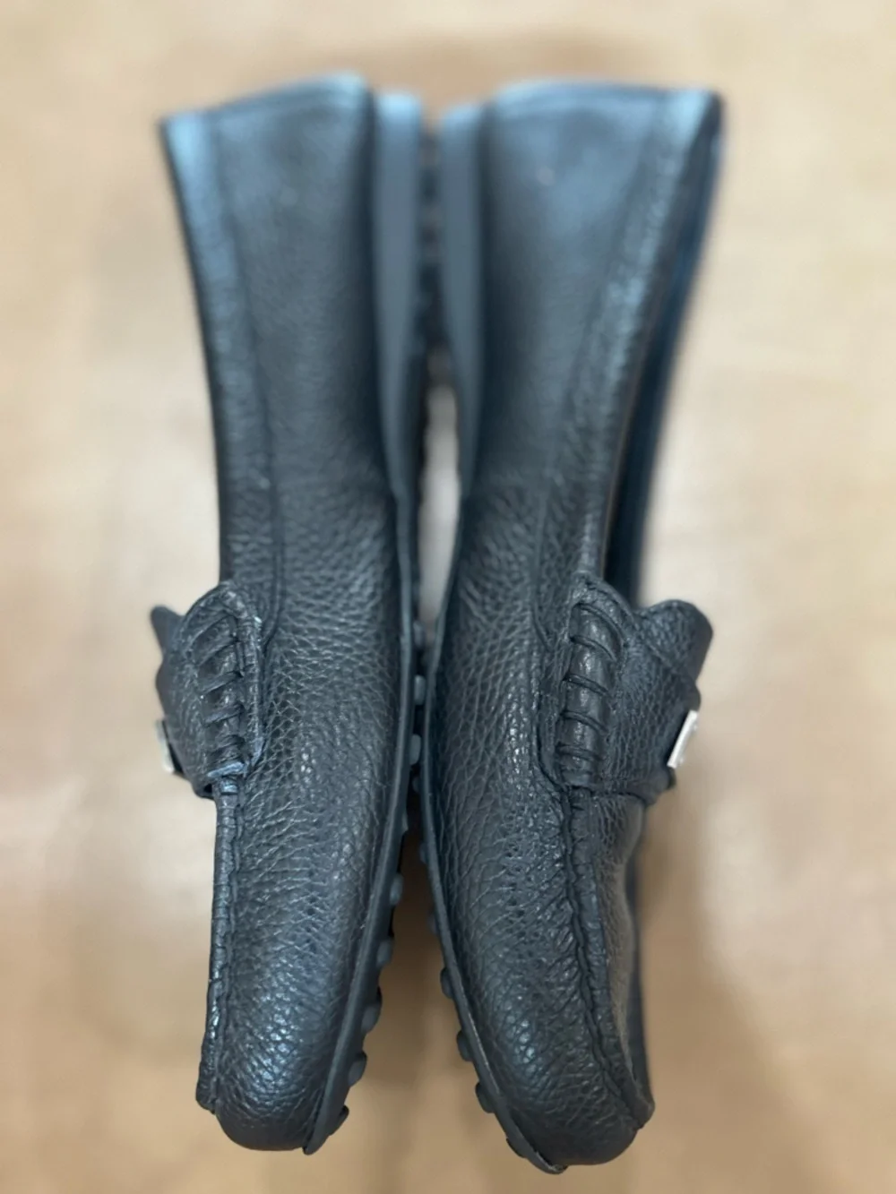 Coach minimalist Black Pebbled Leather Loafers with Silver Plaque